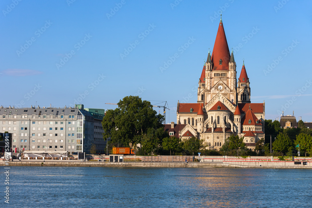 Naklejka premium Austria, city of Vienna, Saint Francis of Assisi Church from 1910 at Danube River.