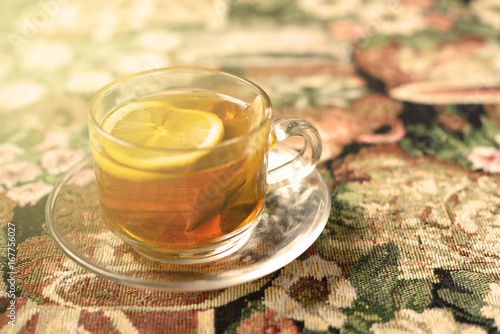 Lemon tea with pattern tablecloth