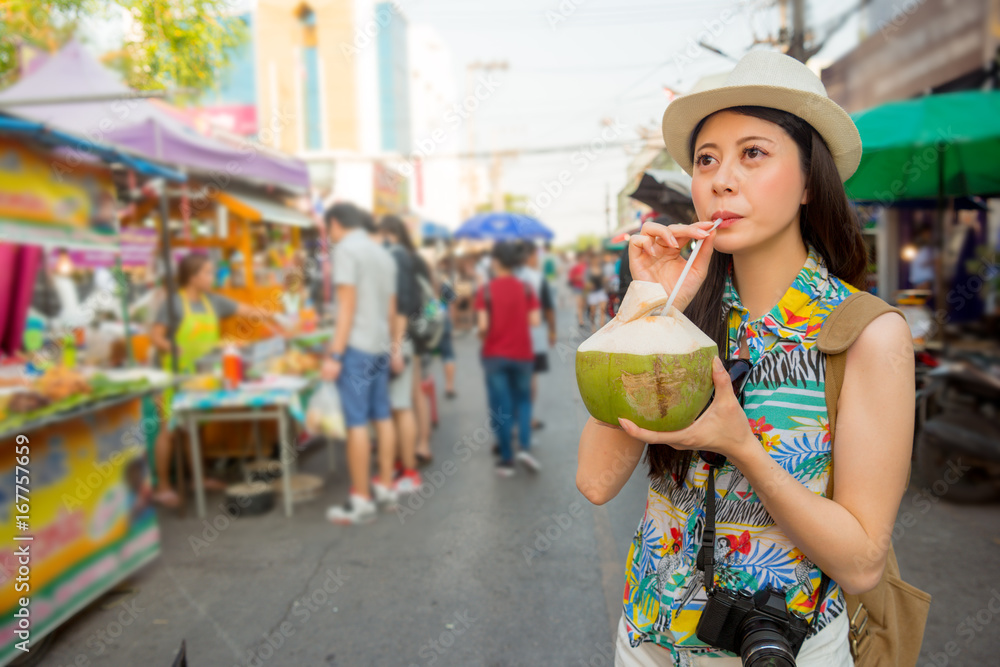 young student drinking fresh coconut water young student drinking fresh coconut water