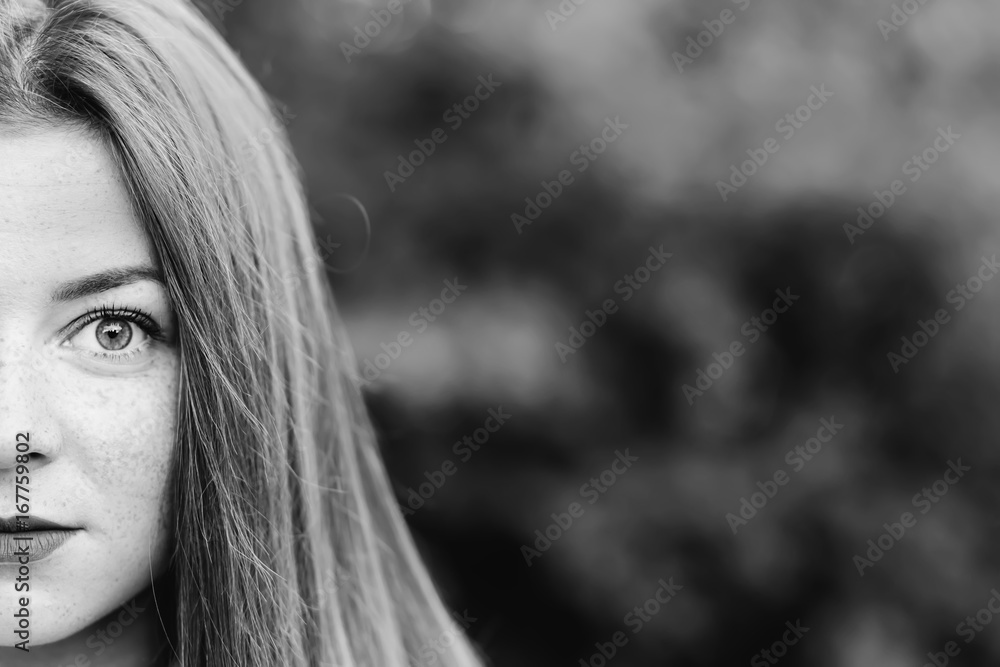 Half portrait of young scared woman looking afraid at camera Half portrait of young scared woman looking afraid at camera