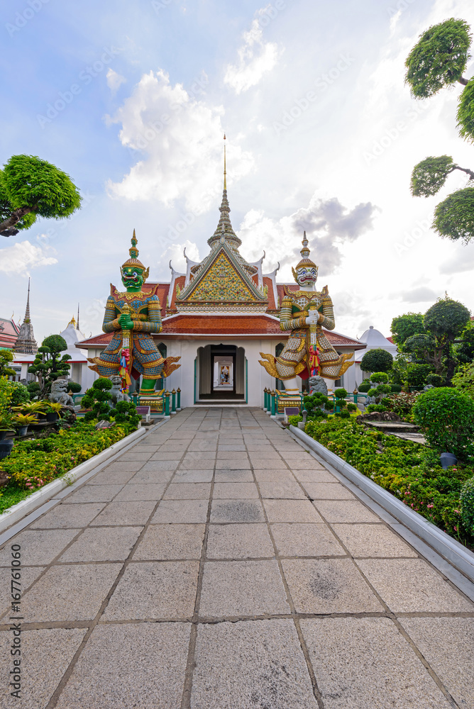 Giant statue in Wat Arun Ratchawararam Ratchawaramahawihan in Thailnd / Public landmark Thai Temple Giant statue in Wat Arun Ratchawararam Ratchawaramahawihan in Thailnd / Public landmark Thai Temple
