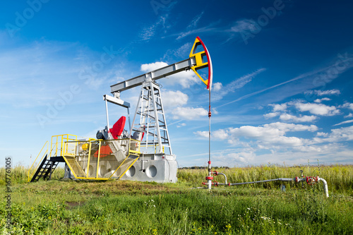 Oil Pump/oil pump on a background of field and sky
