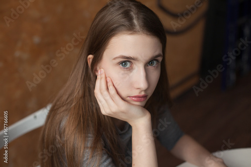 teenage girl sitting and thinking