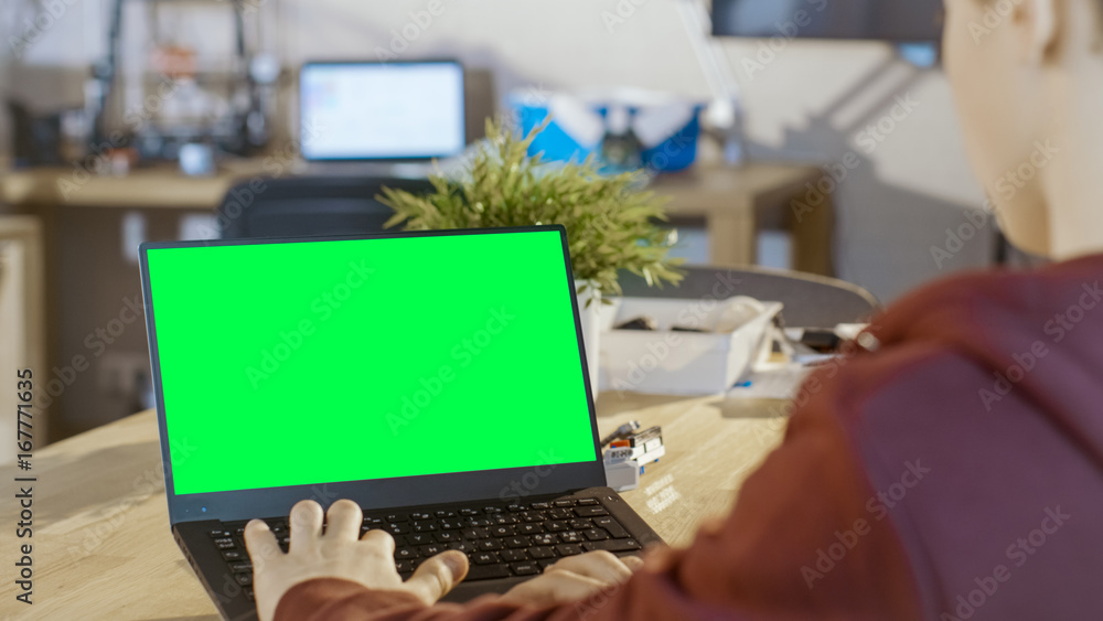 Smart Boy Uses Laptop with Mock-up Green Screen in His Computer Science ...