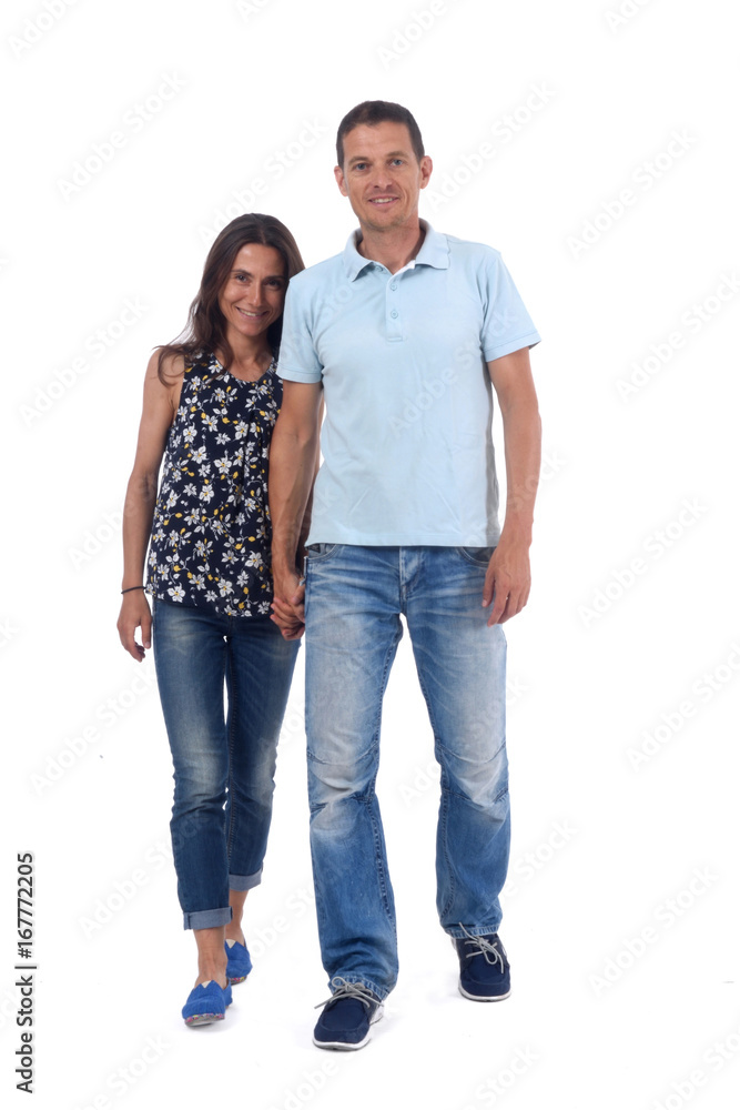 A couple of forty years walking on white background A couple of forty years walking on white background