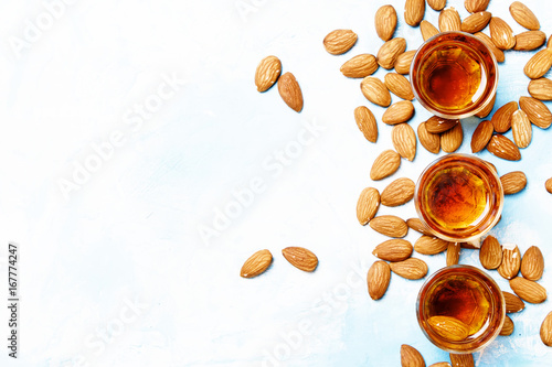 Strong alcoholic drink with almonds, top view