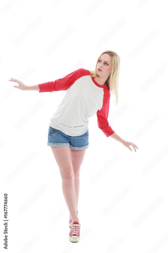 full length portrait of a blonde girl wearing casual t-shirt and denim shorts. isolated on white background.