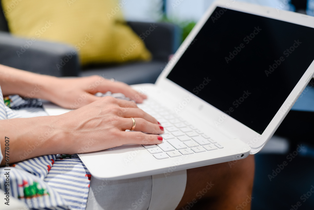 Close up of a woman hands busy typing on a laptop light background. Top side view, copy space photography. Social network communication technology Close up of a woman hands busy typing on a laptop light background. Top side view, copy space photography. Social network communication technology