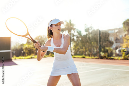 Young female tennis player outdoor playing © Jacob Lund
