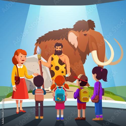 Kids watching big mammoth and caveman at museum