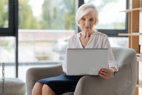 Free Download Smart experienced businesswoman working on the laptop - GFXLoad