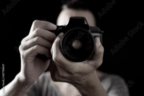Tableau sur toile young man with a reflex camera