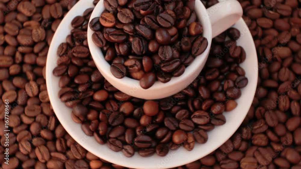 Coffee beans background rotation with a Cup of coffee beans