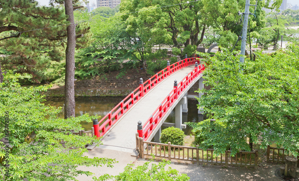 Fototapeta premium Red bridge in Okazaki Castle, Aichi Prefecture, Japan