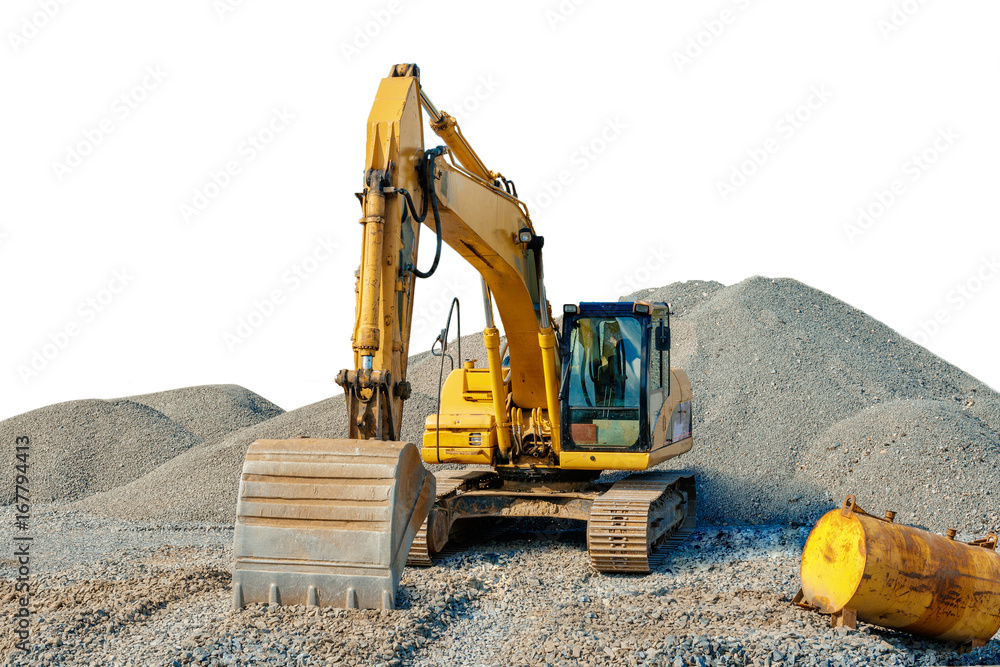 Tracked excavator on a construction site among piles of rubble isolated