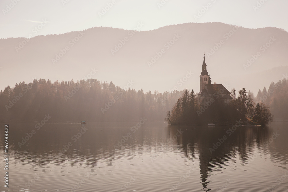 Amazing view on Bled Lake in fog, Slovenia.