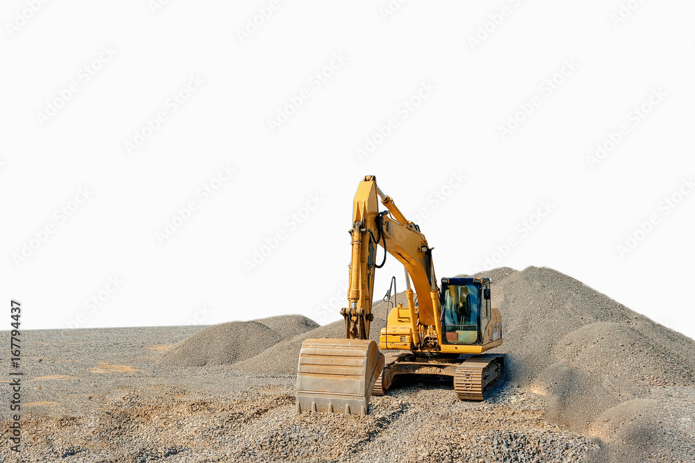 Tracked excavator on a construction site among piles of rubble isolated