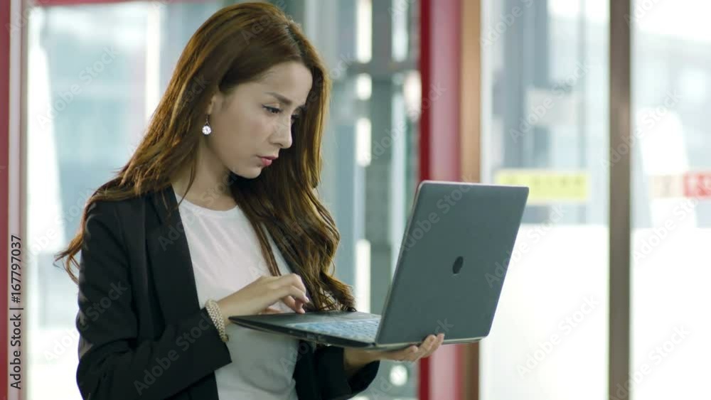 young asian business woman using laptop computer young asian business woman using laptop computer