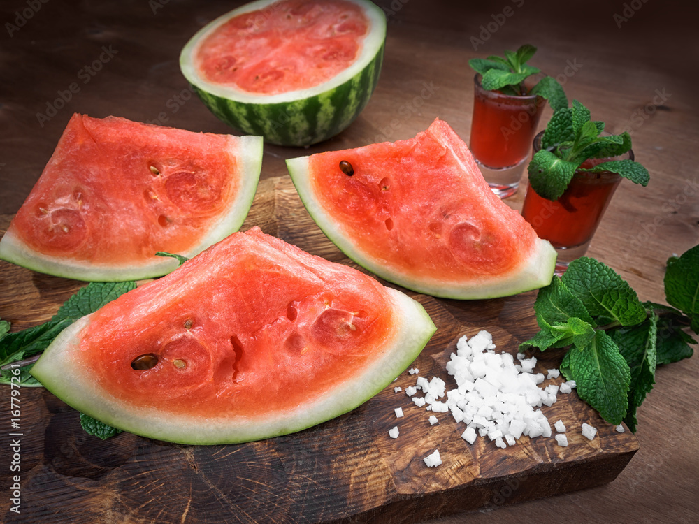 watermelon drink watermelon pieces in a rustic wooden background. watermelon drink watermelon pieces in a rustic wooden background.