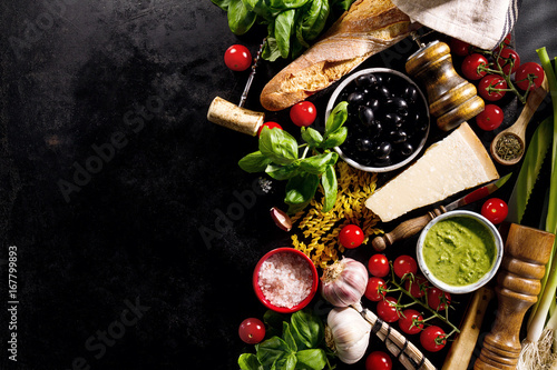 Obraz na plátně Tasty fresh appetizing italian food ingredients on dark background