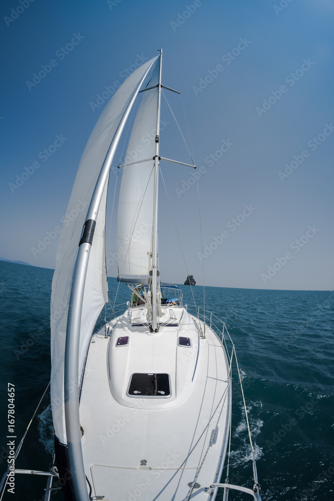 Fototapeta premium Sailing vessel moves in a sea under the sails