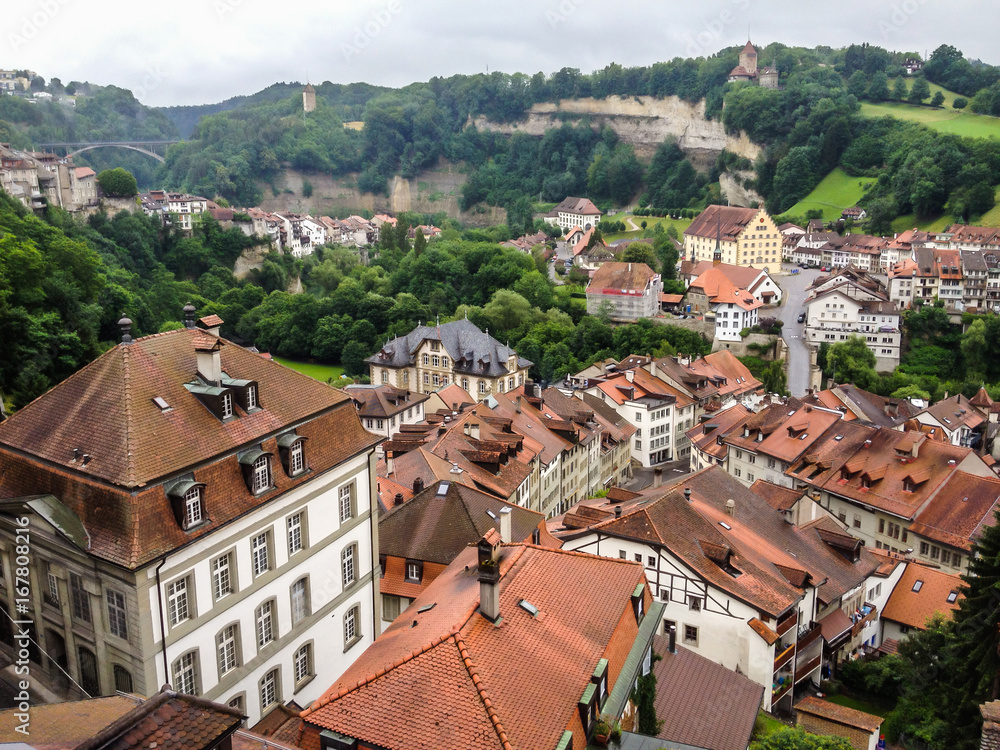 Picturesque cityscape of medieval town Fribourg with its gothic cathedral, old town and ancient fortification, Switzerland, Europe.