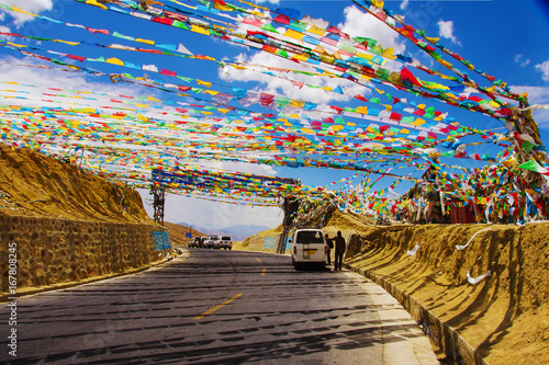 Road to Mount Everest base camp. Last High pass before Mt.Everest, Karo La Pass, or Gyatso La, 5200m, and the Entrance to Qomolangma National Park with buddhist praying flags, Tibet, China, Asia photo