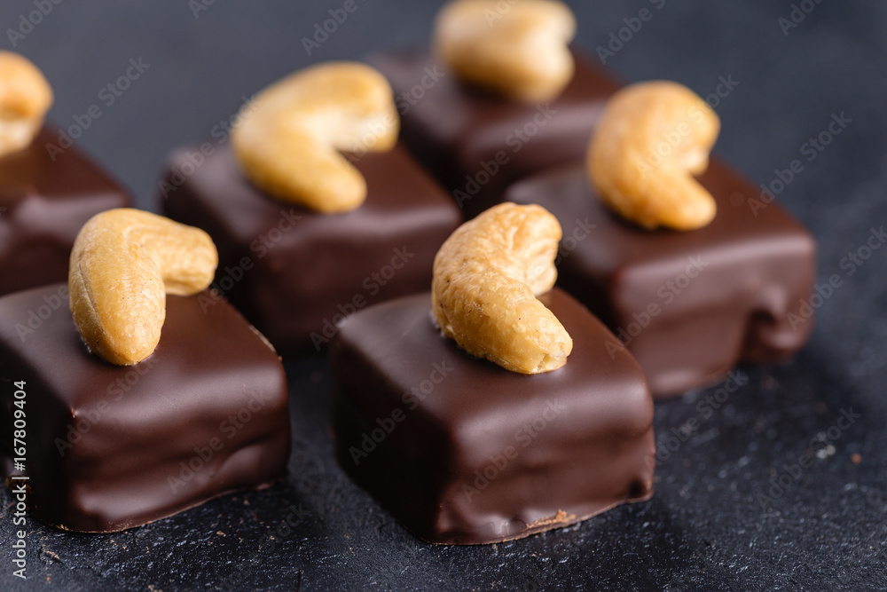 Handmade chocolate bonbons with cashew Handmade chocolate bonbons with cashew
