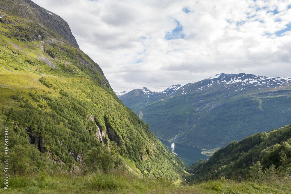 Green mountains surrounding the fjord in Norway