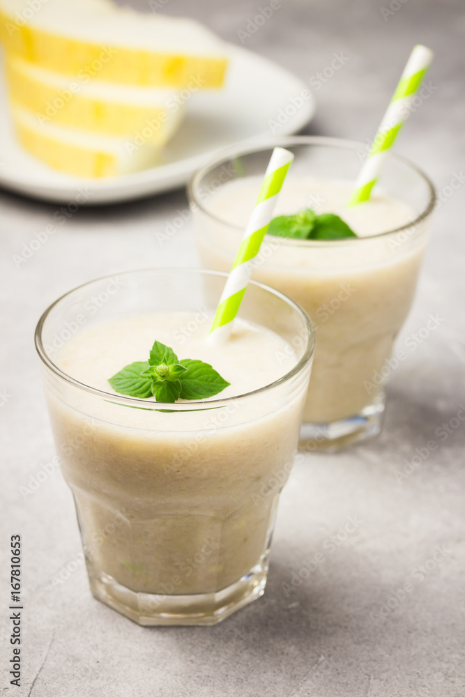 Cantaloupe melon mint smoothie. Beautiful summer drinks concept. Selective focus, copy space. Cantaloupe melon mint smoothie. Beautiful summer drinks concept. Selective focus, copy space.