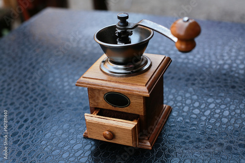 manual coffee grinder with ground coffee