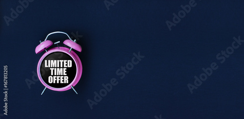 Limited time offer. Pink alarm clock on black background. Dark blue web banner for black friday, sale, discount poster, store promotion