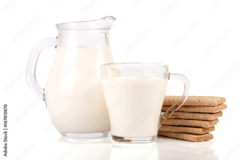 jug and glass of milk with stack of grain crispbreads isolated on white background jug and glass of milk with stack of grain crispbreads isolated on white background