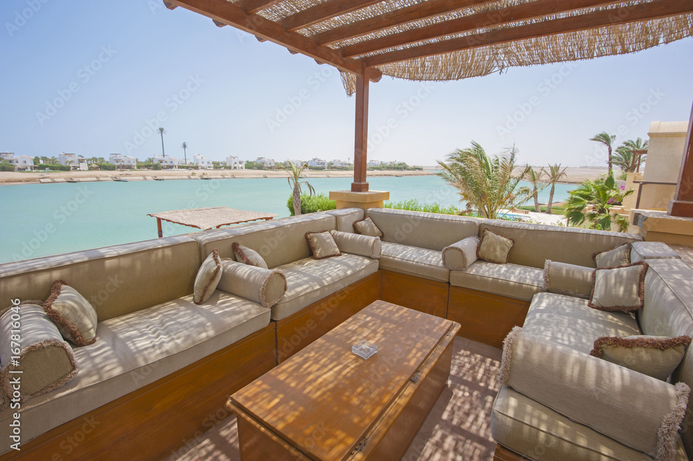 Fototapeta premium Terrace balcony with chairs in tropical luxury apartment