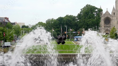 Fountains shooting out like a geyser at the entrance of a corporate building photo