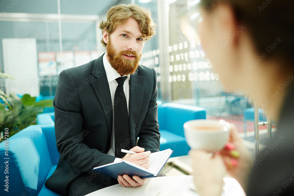 Agency staff planning work for the day or discussing ideas at start-up meeting