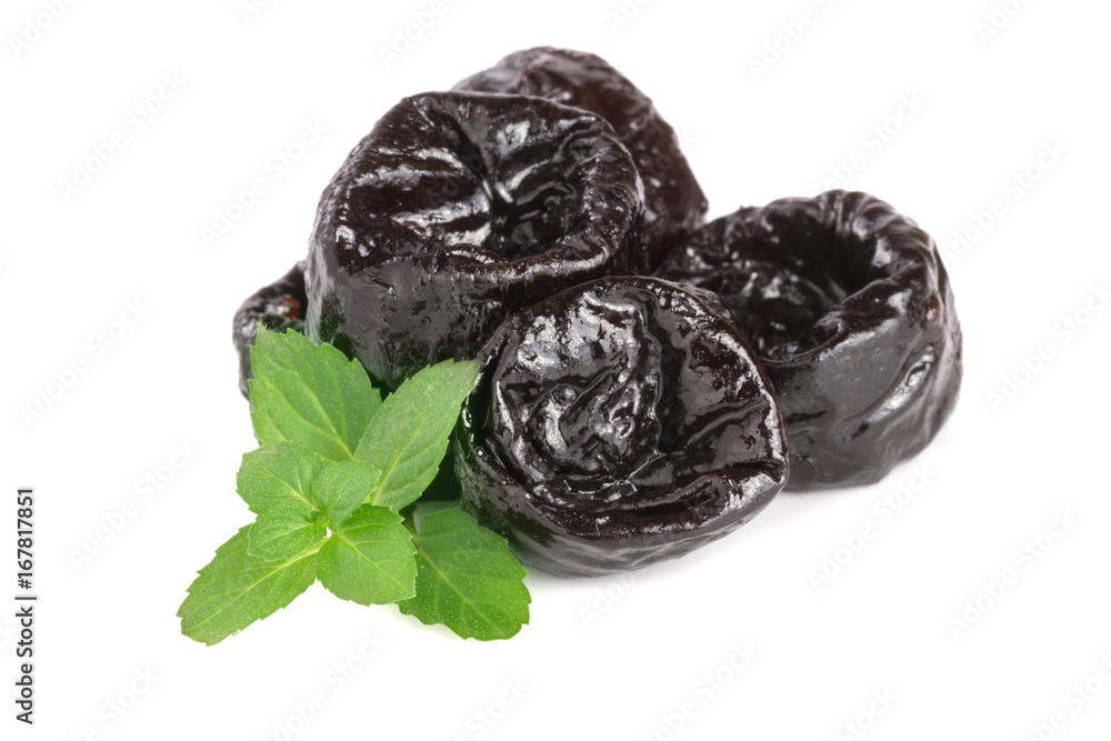 heap of dried plums or prunes with a mint leaf isolated on white background heap of dried plums or prunes with a mint leaf isolated on white background
