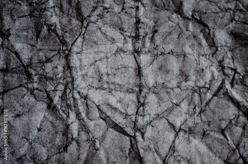 Crumpled black and white paper (as a paper background or paper texture)