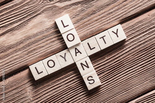 Conceptual business keywords on table with elements of game making crossword
