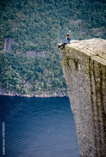 Sitting at the edge of a cliff