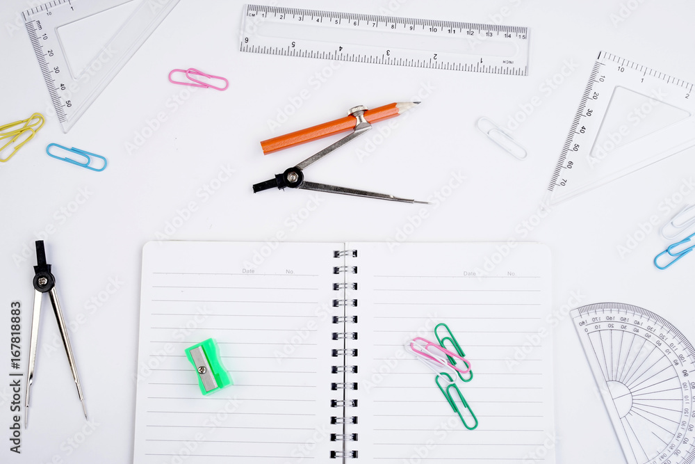 Back to School concept. Studying elements on a white background in a top view or flat lay Back to School concept. Studying elements on a white background in a top view or flat lay