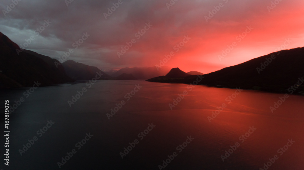 Dramatic sunset over Norwegian fjord - Aerial drone shot
