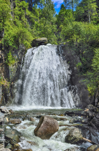 Waterfall Corbu in rocks of lakeTeletskoe, Altai Mountains