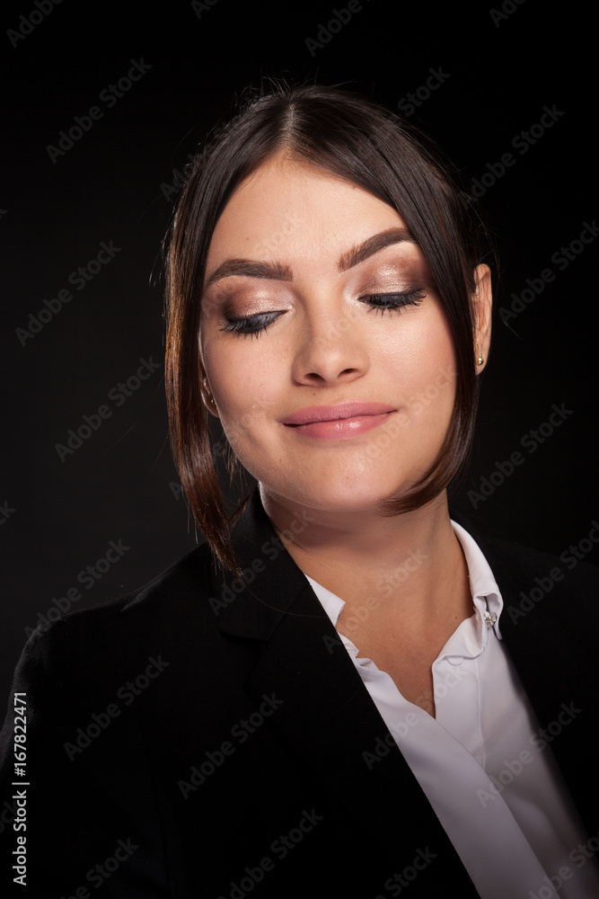Successful businesswoman in studio photo over black background Successful businesswoman in studio photo over black background