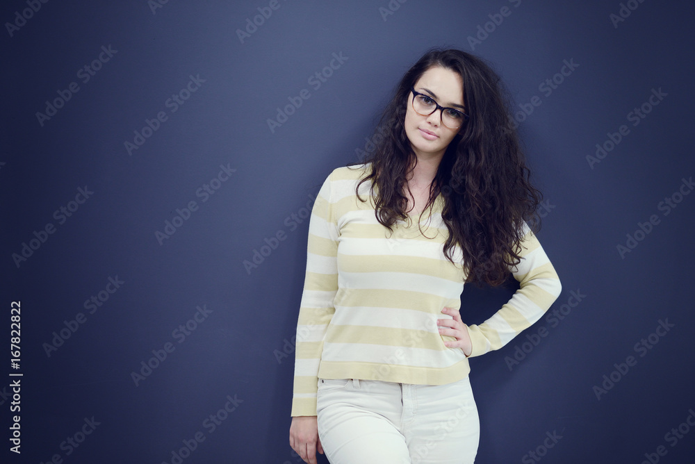 Secretary or business woman with suprised look on her face isolated over dark background Secretary or business woman with suprised look on her face isolated over dark background