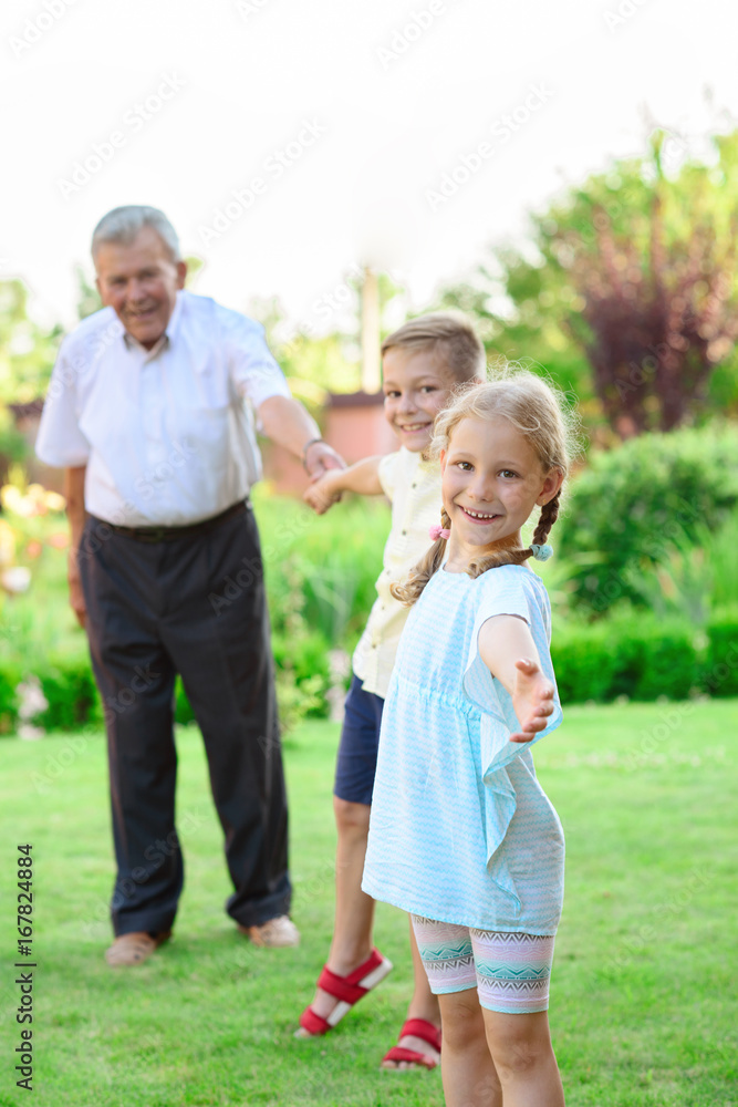 Portrait of happy old grandfather and cute children Portrait of happy old grandfather and cute children