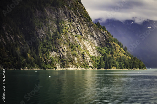 Fjord sun stream through the clouds