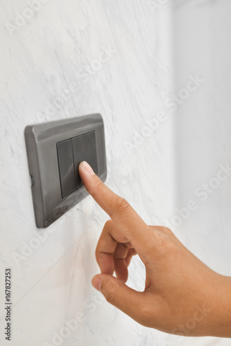 Grey light switch with white marble.