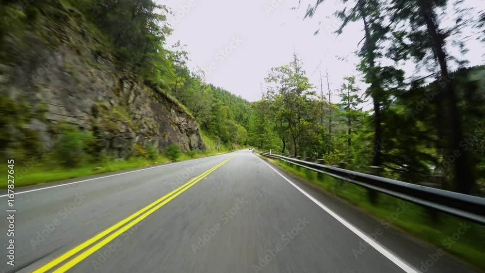 Driving Down Scenic Road, River On Right, Forest Ahead, In Oregon, USA Driving Down Scenic Road, River On Right, Forest Ahead, In Oregon, USA