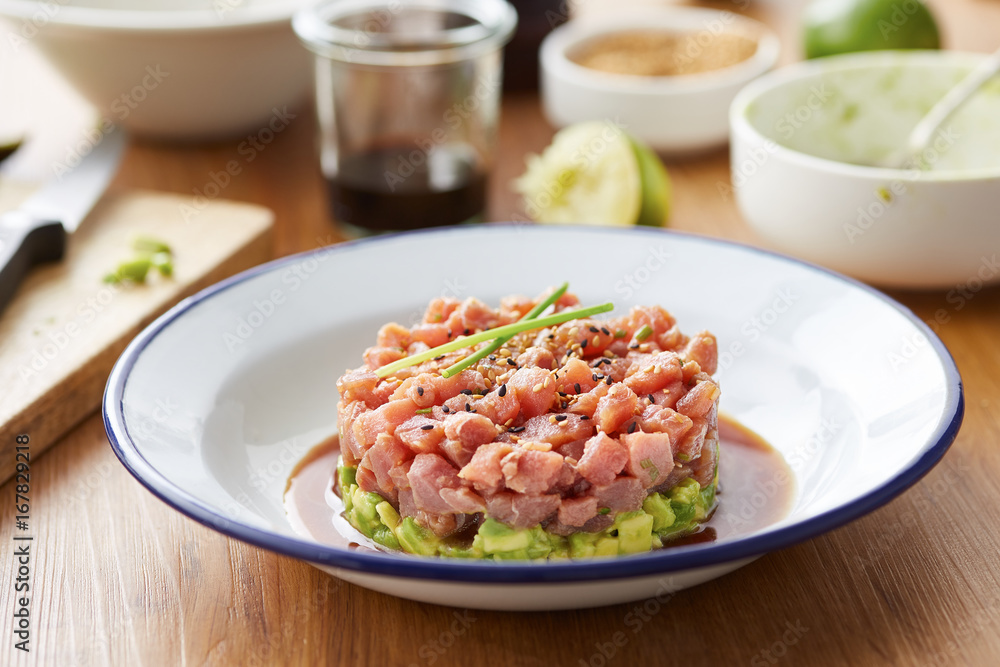 Restaurant served tuna tartare in round shape on plate Restaurant served tuna tartare in round shape on plate